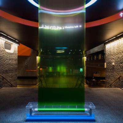 An installation made of glass, water and green paint, situated in the Barbican's foyer